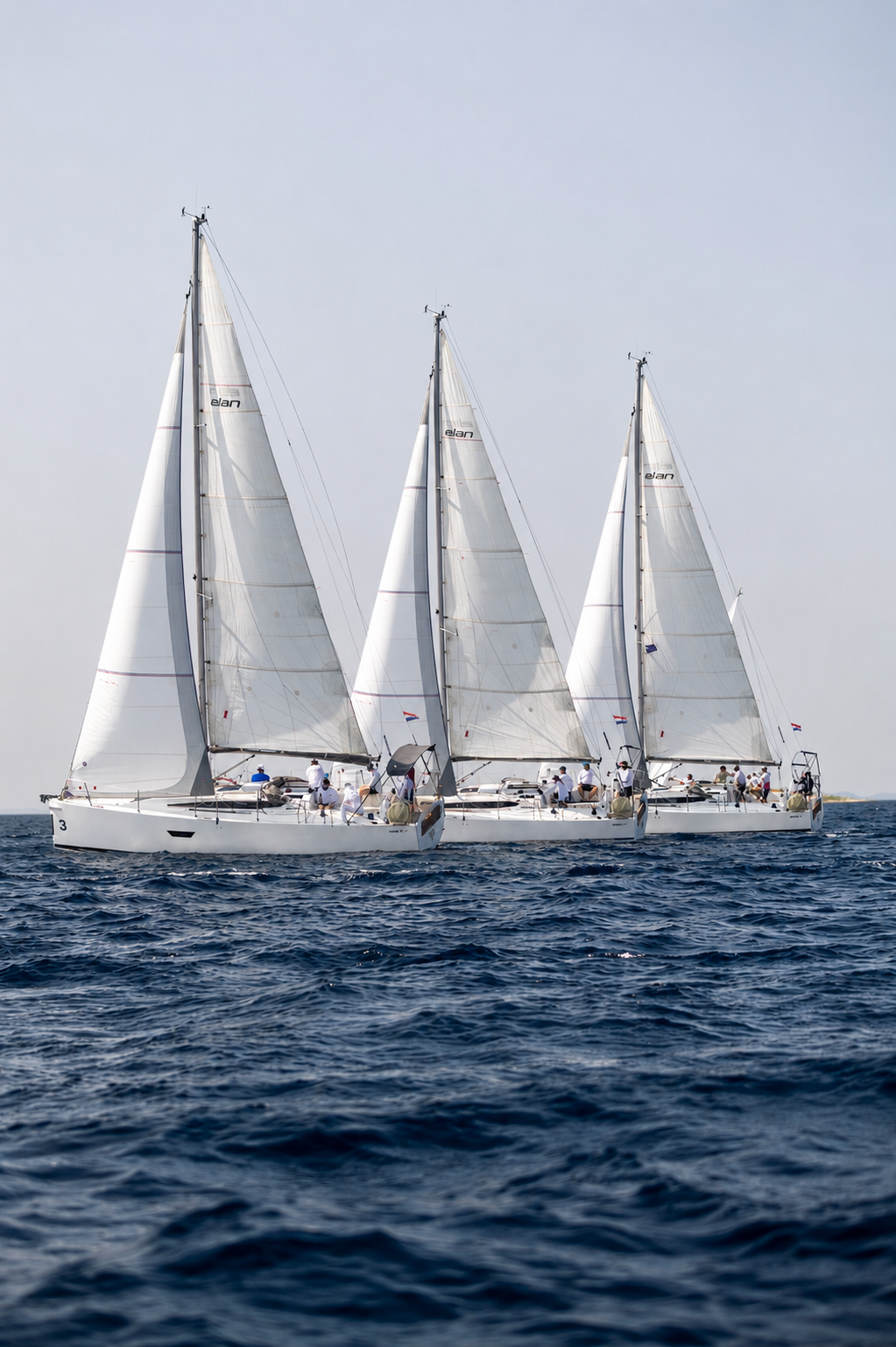 Three sailing yachts cruising the Adriatic